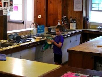 Age five, drying dishes in the Martha's Vineyard Hostel shared kitchen. Age five, drying dishes in the Martha's Vineyard Hostel shared kitchen.